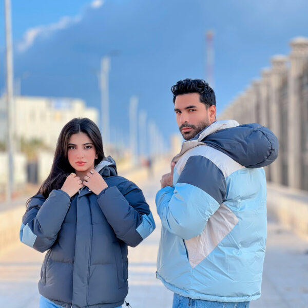 eversible double-face jacket with a detachable hood, lightweight material, and dual-color design.