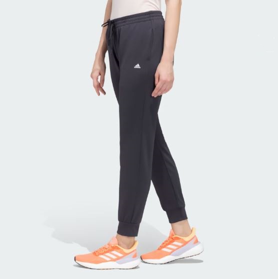 Adidas Women’s Jogger Pants in black with a tapered fit, adjustable drawstring waistband, and side pockets for casual comfort and style.