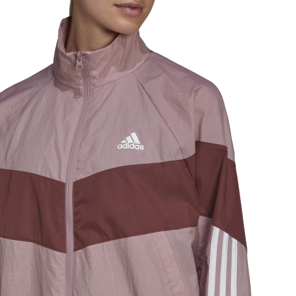 Adidas Women's Pink and Maroon Tracksuit with contrast color design, 3-stripes, and lightweight material