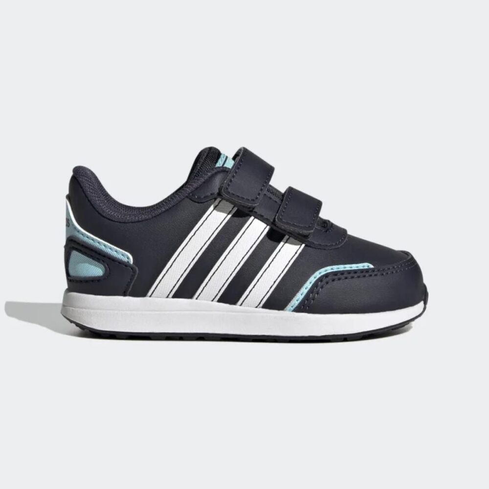 A pair of navy blue Adidas Vs Switch 3 shoes for toddlers with white stripes and hook-and-loop closures.