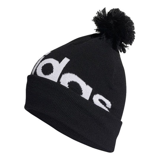 Adidas black and white knit beanie with logo and black pom-pom detail.