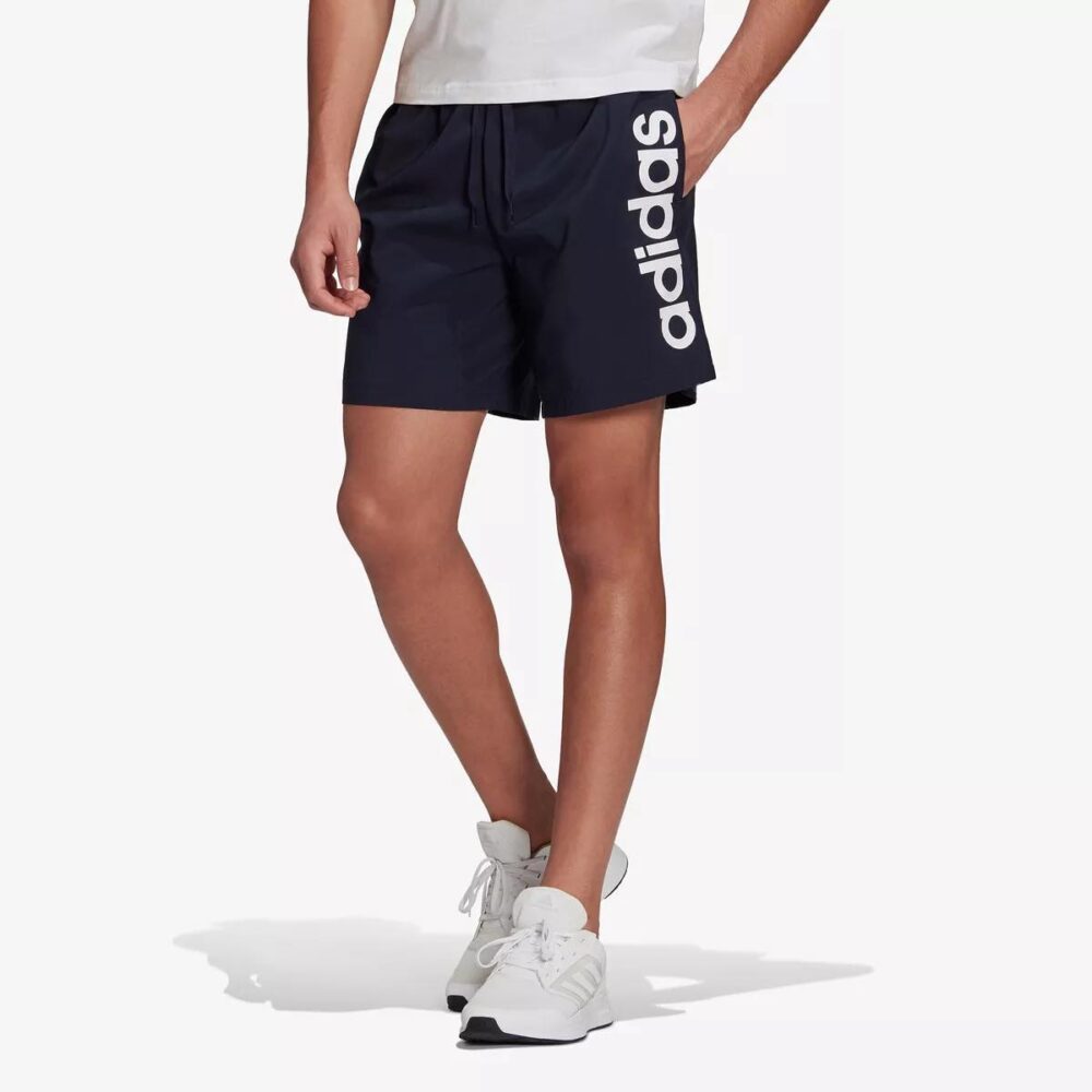 Adidas navy shorts with a bold logo print on the side and adjustable waistband.