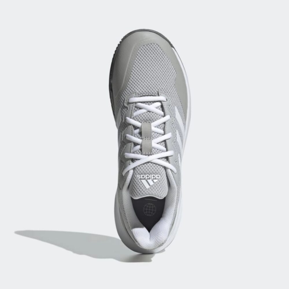 Grey Adidas Gamecourt 2.0 tennis shoes with three stripes and a breathable mesh upper.