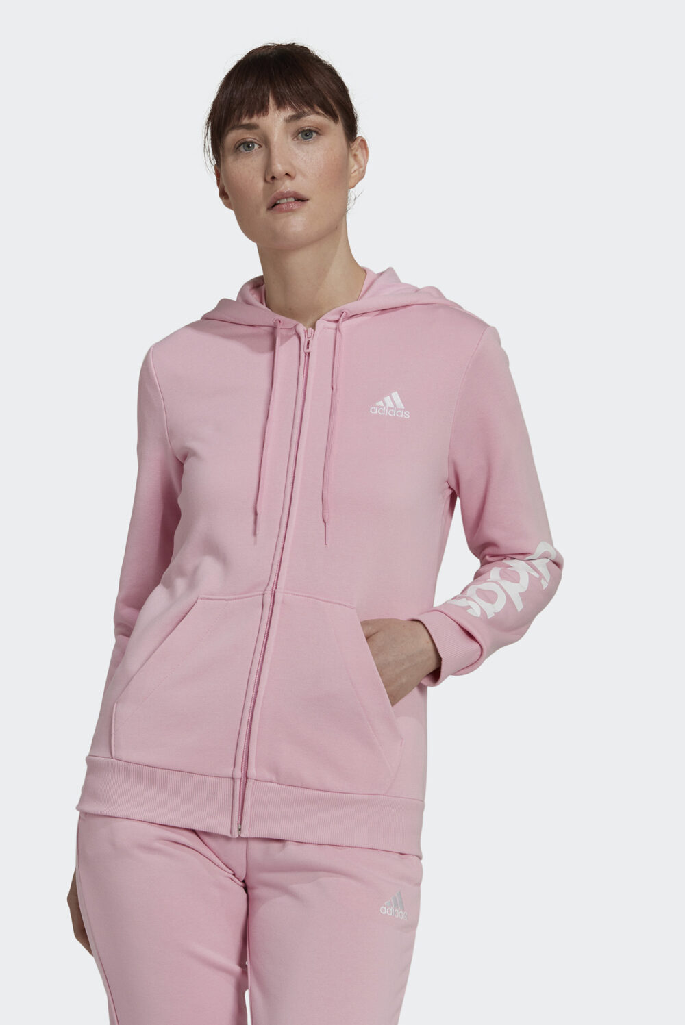 Pink adidas Essentials Linear Logo Full-Zip Hoodie with white adidas logo on the chest and sleeve