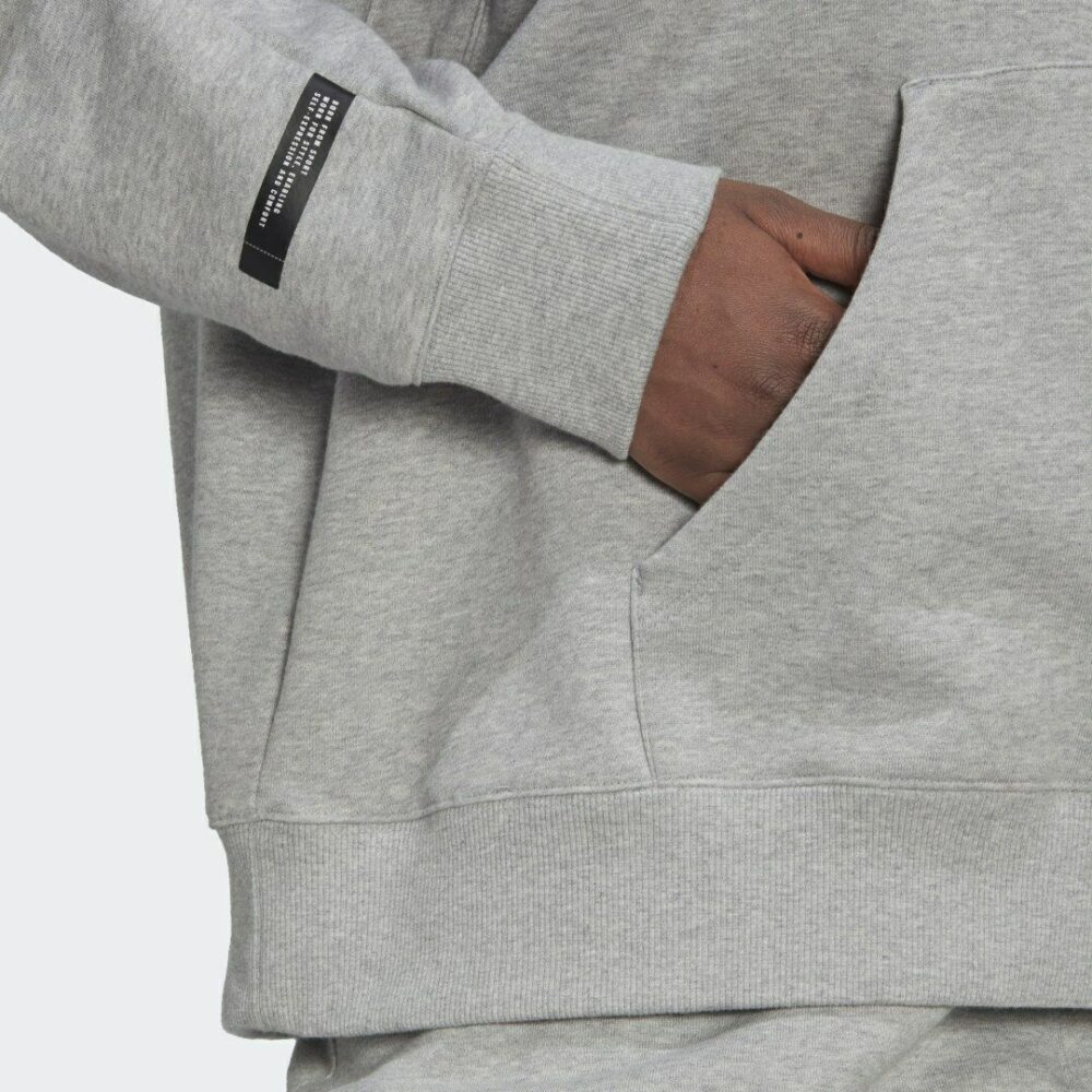 Adidas unisex grey hoodie with a drawstring hood, kangaroo pocket, and soft fleece fabric, ideal for casual wear or lounging.