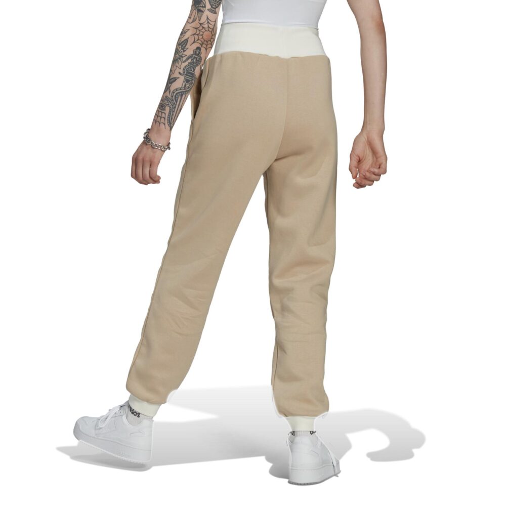 Beige Adidas sweatpants with a white Trefoil logo.