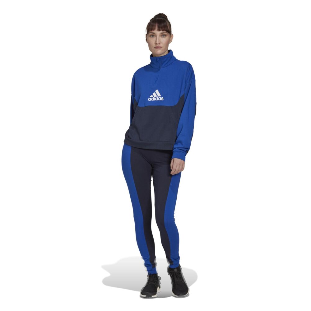 Blue Adidas tracksuit with white 3-Stripes and a half-zip jacket.