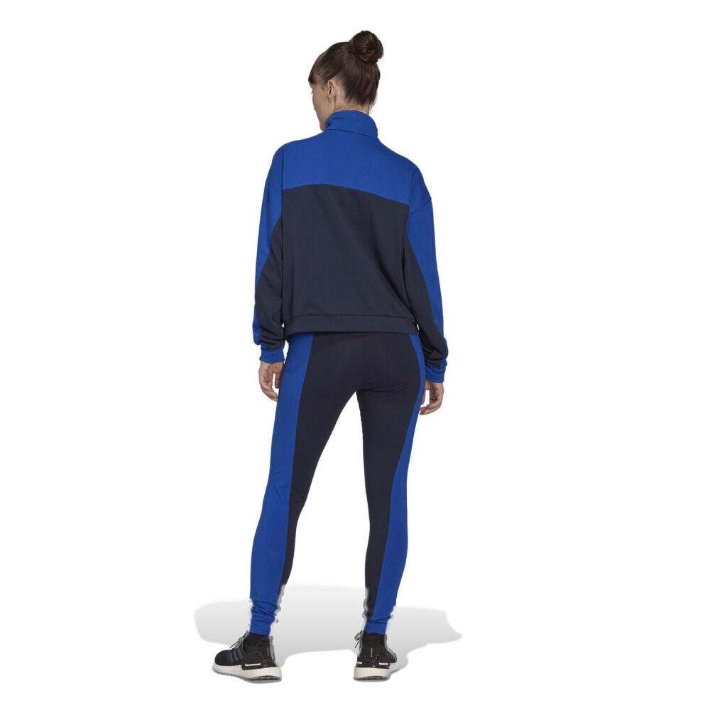 Blue Adidas tracksuit with white 3-Stripes and a half-zip jacket.