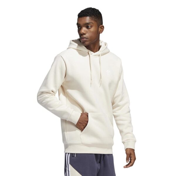 A beige Adidas hoodie with a small Trefoil logo on the left chest.