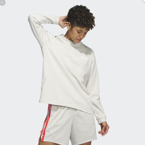 A cream Adidas long-sleeve shirt with a minimalist design and subtle logo on the chest, ideal for casual or everyday wear