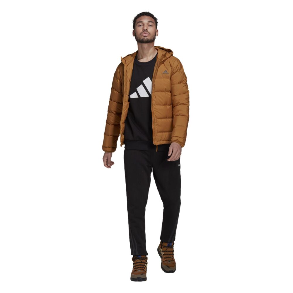 A tan Adidas Essentials Light Down Jacket with a hood and zippered pockets.