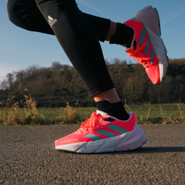 Red Adidas Adistar Running Shoes with a white and gray sole.