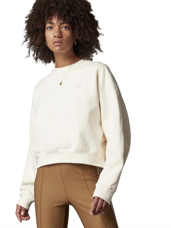 eaturing a relaxed fit and a distinctive batwing sleeve design.