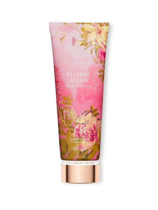 A pink and gold tube of Victoria's Secret Floral Affair Lily & Blush Berries lotion. The tube features an illustration of flowers and a butterfly, with the brand name and product name prominently displayed.