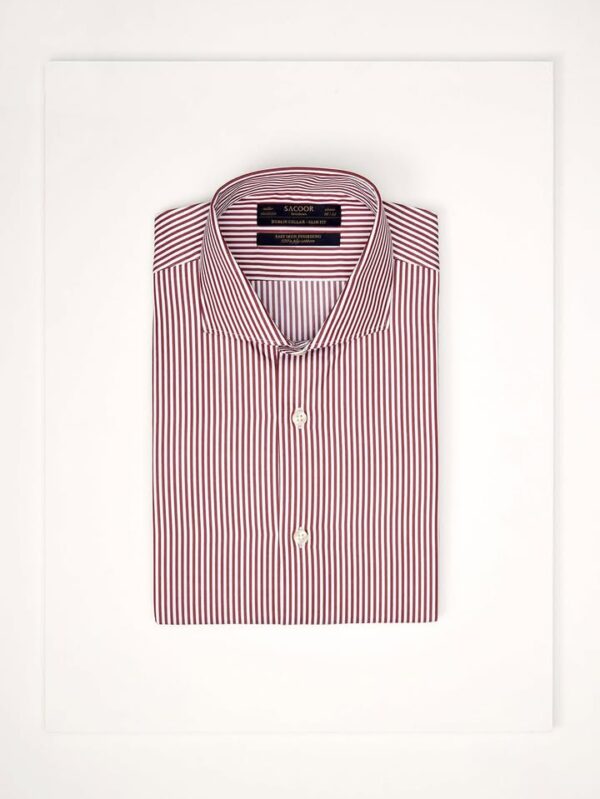 folded Sacoor Brothers slim fit shirt with burgundy and gold vertical stripes is displayed on a white surface.